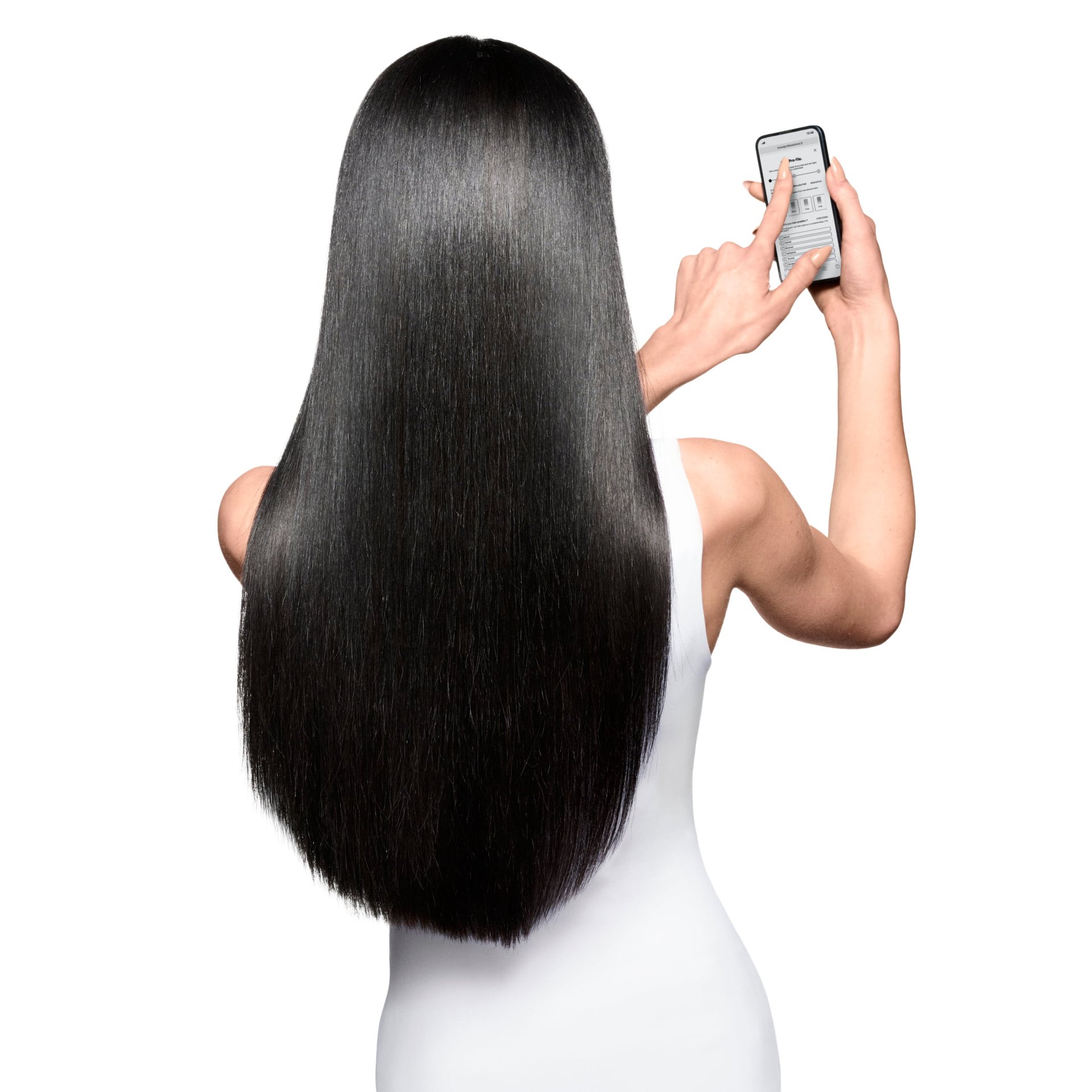 Woman using her phone to access an app for hair diagnosis, helping personalize the ideal hair care routine