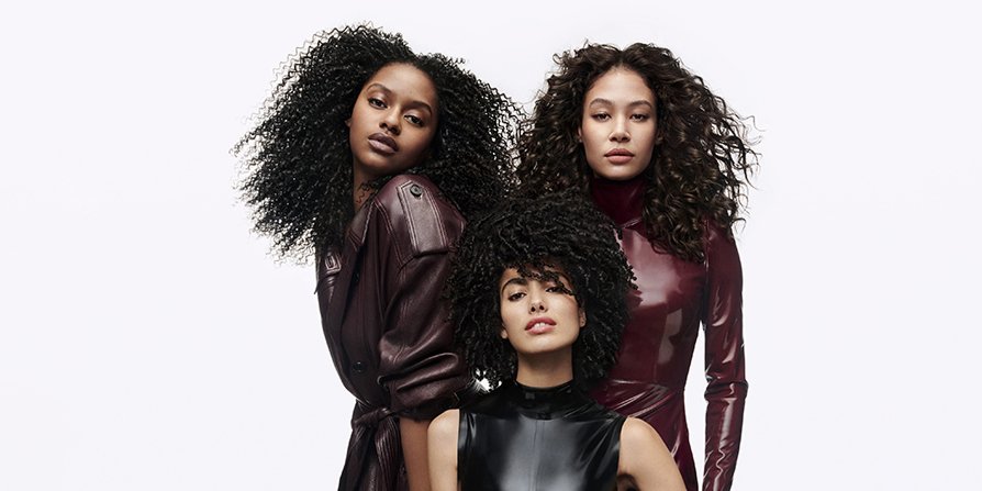 Three women with different types of curly hair, illustrating the versatility of L’Oréal Curly Hair Care routine for every curl type